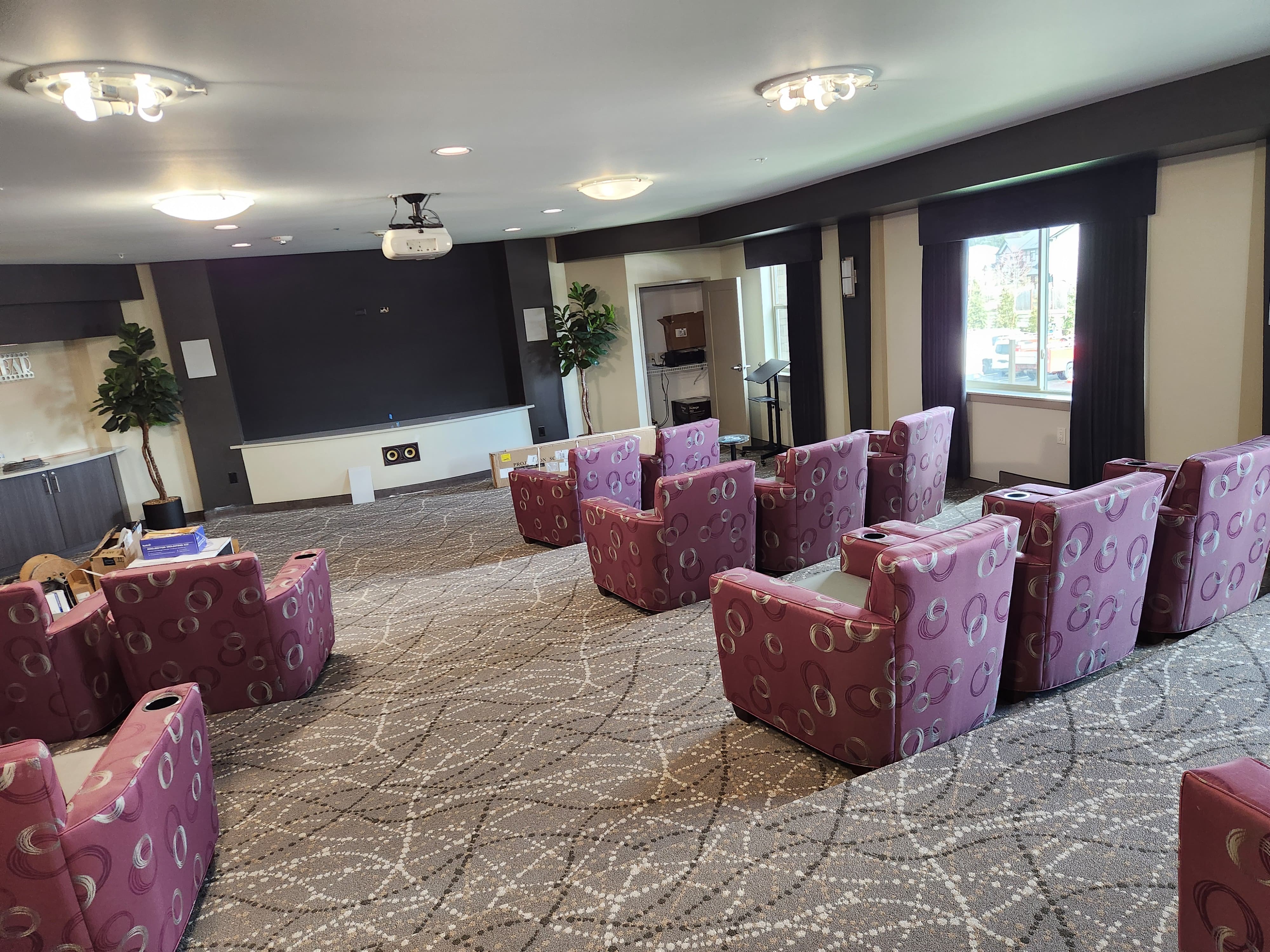 Patterned carpet across the floor of a community theatre