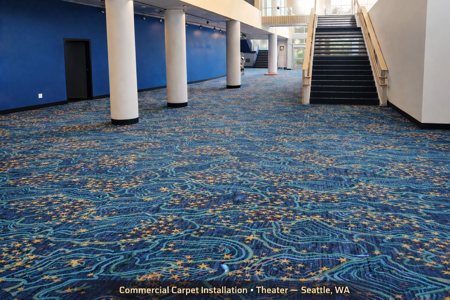 Blue patterned carpet across a Seattle theatre lobby